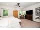 Light-filled main bedroom featuring windows with tree views, and neutral tones at 1403 Chipping Dr, Apex, NC 27502