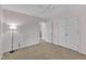 Bedroom features a large window, fresh paint, plush carpet, and closet space at 1420 Willowleaf Way, Apex, NC 27502