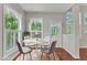 Bright dining area with lots of natural light and hardwood floors at 1420 Willowleaf Way, Apex, NC 27502