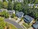 Beautiful home with well-manicured landscaping nestled among lush trees at 1420 Willowleaf Way, Apex, NC 27502