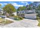 Charming two-story home with a welcoming front porch, well-maintained lawn, and attached garage at 1420 Willowleaf Way, Apex, NC 27502