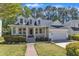 Beautiful two-story home with a covered porch and well-maintained landscaping at 1420 Willowleaf Way, Apex, NC 27502