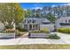 Charming two-story home boasts a manicured lawn and inviting front porch at 1420 Willowleaf Way, Apex, NC 27502