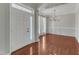 Bright foyer with hardwood floors, chandelier, white door, and fresh paint at 1420 Willowleaf Way, Apex, NC 27502
