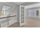 Hallway with views of stairway, bedroom, and beautiful natural light at 1420 Willowleaf Way, Apex, NC 27502