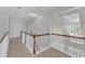 Bright upstairs hallway featuring fresh paint, new carpet, and modern fixtures at 1420 Willowleaf Way, Apex, NC 27502