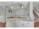 Kitchen breakfast bar that opens to a living area with high ceilings at 1420 Willowleaf Way, Apex, NC 27502