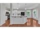 View of kitchen with breakfast bar and hardwood floors at 1420 Willowleaf Way, Apex, NC 27502
