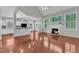 Bright living area with hardwood floors, fireplace, and open layout at 1420 Willowleaf Way, Apex, NC 27502