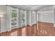 Bright and spacious living room with hardwood floors and plenty of natural light at 1420 Willowleaf Way, Apex, NC 27502