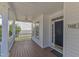Spacious porch features wood flooring and classic architectural details at 1420 Willowleaf Way, Apex, NC 27502