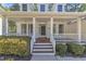 Inviting covered porch with ceiling fans and lovely views at 1420 Willowleaf Way, Apex, NC 27502