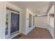 Charming covered porch featuring wood floors and beautiful natural light at 1420 Willowleaf Way, Apex, NC 27502