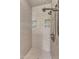 Nicely tiled shower featuring multiple shower heads and inset shelves at 1420 Willowleaf Way, Apex, NC 27502