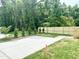 Expansive backyard featuring a newly installed wooden fence and a concrete patio at 1448A Maplewood Dr, Durham, NC 27704