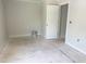 The bedroom has neutral paint, a bright window, and ample space at 1448A Maplewood Dr, Durham, NC 27704