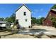 View of the home's exterior showing the backyard, stairs, and concrete patio at 1448A Maplewood Dr, Durham, NC 27704