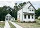 New construction home featuring a modern farmhouse design with white siding and a well-maintained yard at 1448A Maplewood Dr, Durham, NC 27704