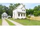 Charming two-story home with a well-maintained lawn and a concrete driveway at 1448A Maplewood Dr, Durham, NC 27704