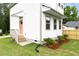 Side angle showcasing a well maintained, two-story home, landscaping, and manicured lawn at 1448A Maplewood Dr, Durham, NC 27704