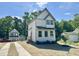 Beautiful new home showcases a well-manicured lawn and stylish architectural details at 1448A Maplewood Dr, Durham, NC 27704