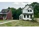 Three houses featuring different exterior colors: white, gray, and maroon sit in a grassy field at 1448A Maplewood Dr, Durham, NC 27704