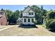 Attractive house features a gray and white exterior and professionally landscaped front yard at 1448A Maplewood Dr, Durham, NC 27704