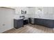 Modern kitchen featuring stainless steel appliances, stylish cabinetry, and sleek countertops at 1448A Maplewood Dr, Durham, NC 27704