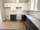 Stylish kitchen featuring sleek cabinets, modern finishes, and ample storage space at 1448A Maplewood Dr, Durham, NC 27704