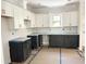 Modern kitchen with stylish two-tone cabinetry, and plenty of counter space at 1448A Maplewood Dr, Durham, NC 27704