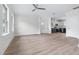 Open-concept living space with hardwood floors, recessed lighting, and an adjacent kitchen at 1448A Maplewood Dr, Durham, NC 27704