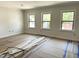 Bright living room featuring large windows and ample natural light at 1448A Maplewood Dr, Durham, NC 27704