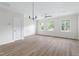 Large, open living area with light hardwood floors, recessed lighting, and plenty of windows at 1448A Maplewood Dr, Durham, NC 27704