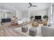 Stylishly decorated living room with modern furniture, light hardwood floors, and natural light at 1448A Maplewood Dr, Durham, NC 27704