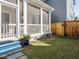 A shot of the grassy backyard with access to the screened in porch/patio at 1517 Millrock Trl, Wendell, NC 27591
