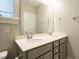 Bathroom with double sinks, sleek gray vanity, and modern fixtures at 1517 Millrock Trl, Wendell, NC 27591