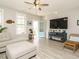 Inviting living room showcasing a large TV and decor, plus an open doorway at 1517 Millrock Trl, Wendell, NC 27591