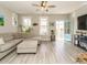 Open living room with light-filled windows and a stylish light blue front door at 1517 Millrock Trl, Wendell, NC 27591