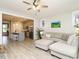 Spacious open-plan living area with a comfortable sofa that flows into the kitchen at 1517 Millrock Trl, Wendell, NC 27591