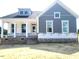 Charming two-story new home with a covered porch and modern gray siding at 152 Cultivator Ct, Angier, NC 27501