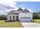 Charming single-Gathering home with a two-car garage, a front porch, and beautiful curb appeal at 152 Cultivator Ct, Angier, NC 27501
