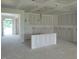 Spacious living room with ample natural light, open floor plan, and modern drywall at 152 Cultivator Ct, Angier, NC 27501