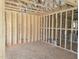 Unfinished room highlighting new construction framing, electrical outlets, and an open floor plan at 152 Cultivator Ct, Angier, NC 27501