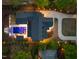 A bird's-eye view shows an estate with a pool, patio, driveway, and lush landscaping at 1616 Hunting Ridge Rd, Raleigh, NC 27615
