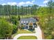 Stunning home boasts a spacious circular driveway, lush lawn, and beautiful landscaping at 1616 Hunting Ridge Rd, Raleigh, NC 27615