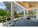 Beautiful backyard patio with outdoor seating, ceiling fan, clear views, and a pool at 1616 Hunting Ridge Rd, Raleigh, NC 27615