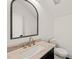 Stylish bathroom features a large mirror, elegant vanity, and modern fixtures at 1616 Hunting Ridge Rd, Raleigh, NC 27615