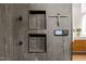 Sleek shower controls and storage shelves in an elegantly tiled bathroom at 1616 Hunting Ridge Rd, Raleigh, NC 27615