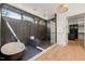Lavish bathroom with a freestanding tub, walk-in shower, and floor to ceiling tile at 1616 Hunting Ridge Rd, Raleigh, NC 27615