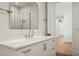 Chic bathroom featuring a contemporary vanity with white countertop, stylish hardware, and a large mirror at 1616 Hunting Ridge Rd, Raleigh, NC 27615